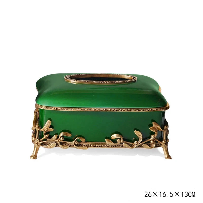 Green tissue box with gold decorative frame on a white background