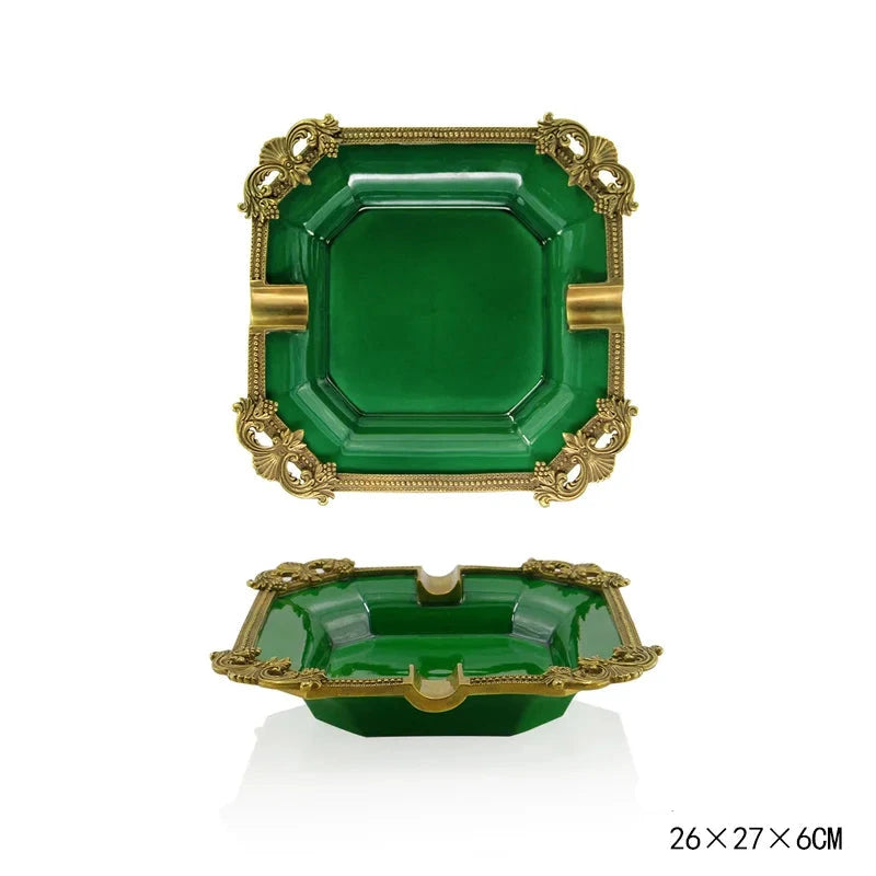 Green and gold decorative ashtray set on a white background